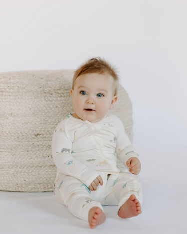 Baby wearing modal zoo print footy pajamas