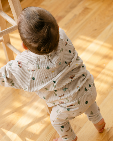 Image shows baby boy wearing organic cotton waffle long sleeve tee in camping.