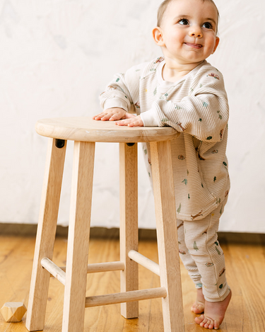 Image shows baby boy wearing organic cotton waffle long sleeve tee in camping.