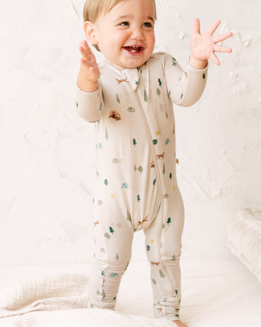 image shows  baby boy wearing modal convertible footy pajamas in camping print