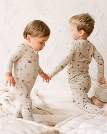 image shows  baby boy wearing modal convertible footy pajamas in camping print