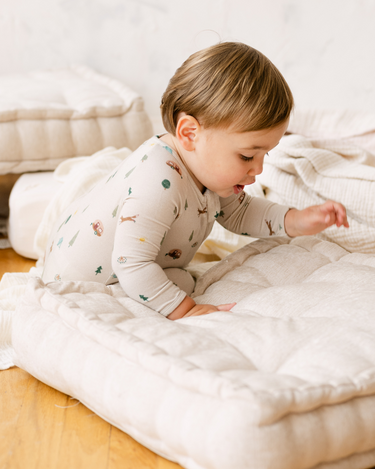 image shows  baby boy wearing modal convertible footy pajamas in camping print