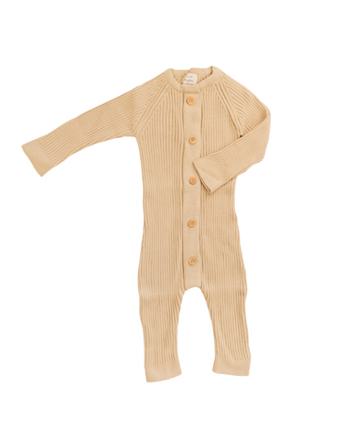 Image shows organic cotton rib knit romper in sandcastle with Magnetic Buttons from neck to crotch for easy changing.
