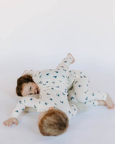 Image shows kids wearing modal pajama sets in panda print.