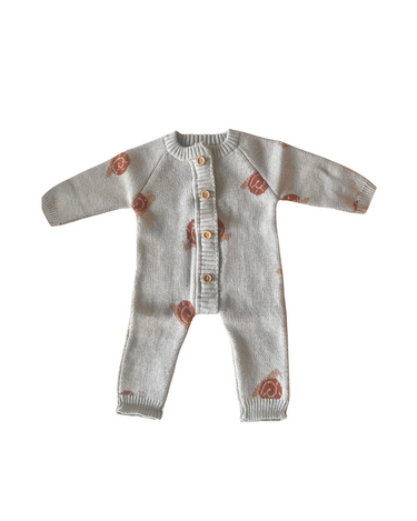 image shows organic cotton knit romper with snail jacquard pattern in pearl blue