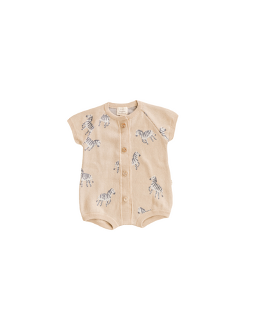 organic cotton knit short playsuit in mushroom beige with zebra jacquard pattern and Magnetic Buttons from neck to crotch for easy changing.