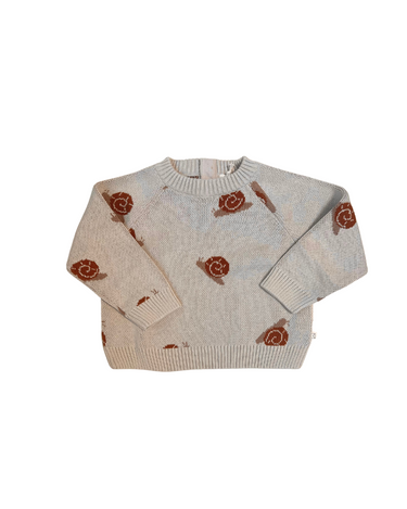 Image shows flat lay image of organic cotton knit sweater with snail jacquard pattern in oatmeal.