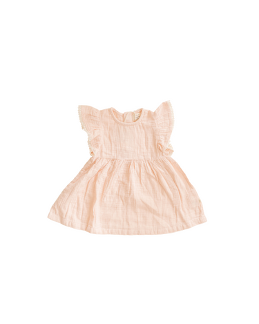 Image shows organic cotton muslin flutter sleeve dress in orchid pink.