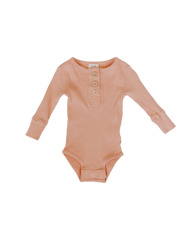 Flat lay image of organic cotton rib bodysuit with Magnetic Buttons in neutral basil color. Bodysuit opens with Magnetic Buttons at the neck as well as crotch.