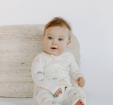 Baby wearing modal zoo print footy pajamas