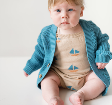 Baby Wearing Romper and Cardigan