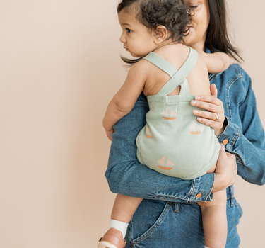 Baby in Romper With Mom