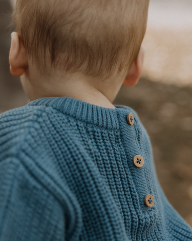 baby boy wearing organic cotton chunky knit set in blue stone dear hayden