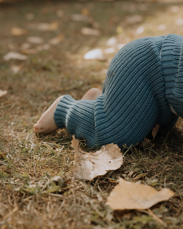 baby boy wearing organic cotton chunky knit set in blue stone dear hayden