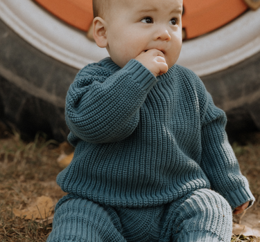 baby boy wearing organic cotton chunky knit set in blue stone dear hayden