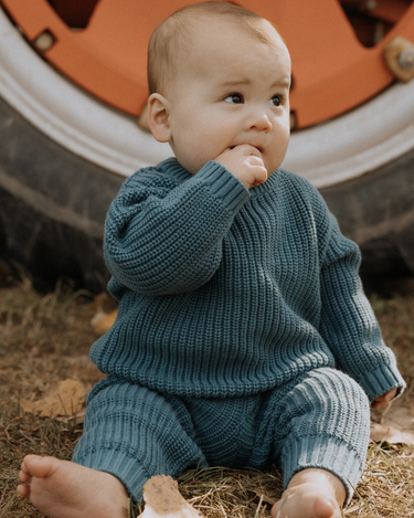 baby boy wearing organic cotton chunky knit set in blue stone dear hayden