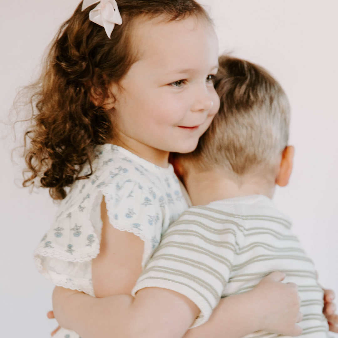 Siblings wearing Dear Hayden organic cotton