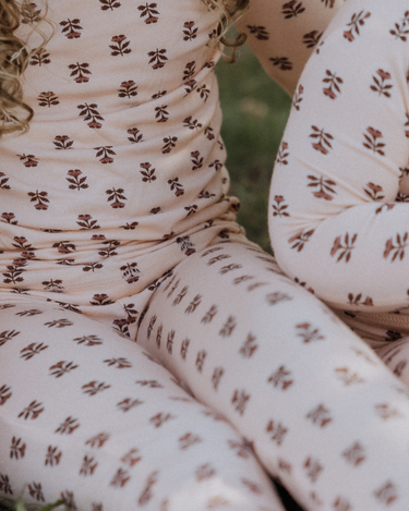 toddler girl wearing modal pajama set in light pink color with rose floral pattern