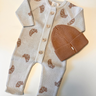 Image shows bundle with organic cotton knit croissant romper and organic cotton knit beanie in acorn.