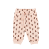 flat lay image of organic cotton fleece joggers in light pink with rose floral pattern for babies and kids