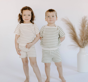 Little boy wearing organic cotton knit stripe short set in sage and little girl wearing the matching mushroom stripe set