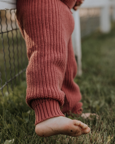 image of toddler girl wearing Dear Hayden organic cotton chunky knit set in rosewood pink