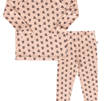 flat lay image of modal pajama set in light pink color with rose floral pattern