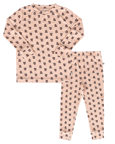 flat lay image of modal pajama set in light pink color with rose floral pattern