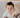 photo shows baby boy looking up at camera wearing modal footy pajamas in Paris print