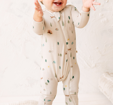 image shows  baby boy wearing modal convertible footy pajamas in camping print