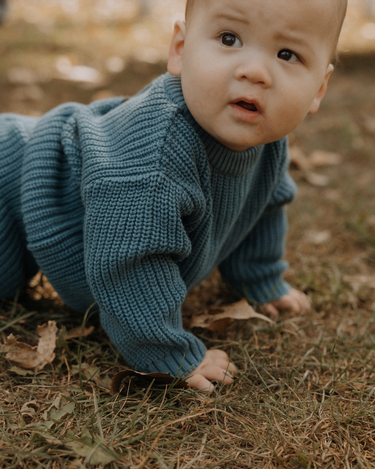 baby boy wearing organic cotton chunky knit set in blue stone dear hayden