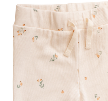 Image shows close up of organic cotton modal rib leggings in floral bud with faux drawstrings at waist,
