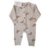 Flat lay image on white background of organic cotton knit croissant patterned romper with Magnetic Button closures.