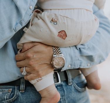 baby wearing organic cotton fleece joggers with farm pattern