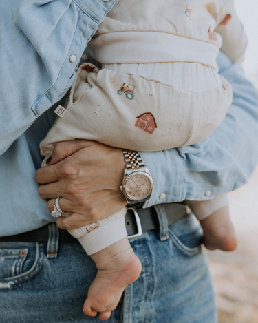 baby wearing organic cotton fleece joggers with farm pattern