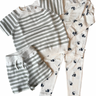 this image shows our toddler warm weather bundle with our organic cotton knit stripe set in sage and our toddler modal pajama set in panda.