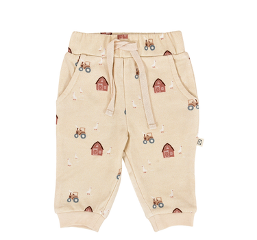 flat lay image of organic cotton fleece joggers in farm print with light beige color
