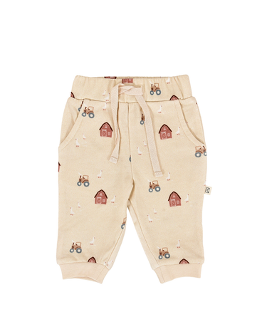 flat lay image of organic cotton fleece joggers in farm print with light beige color