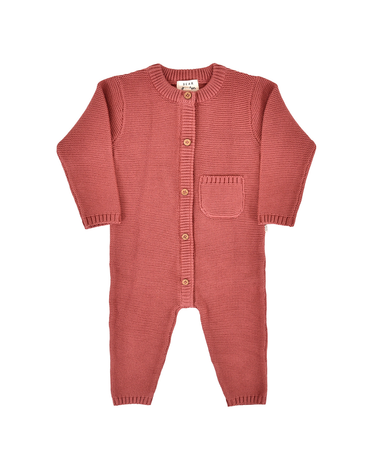 flat lay image of organic cotton garter stitch romper with magnetic closures from neck to crotch in rosewood pink color
