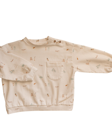Organic cotton italian fleece sweatshirt in Paris print with magnetic buttons at shoulder and pocket on chest.