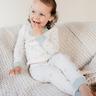 Image shows toddler girl wearing organic cotton modal rib toddler pajama set in floral bud. 