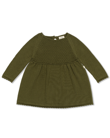 Image Flat lay image of knit dress in crocodile color with sweet details and button detail at the back of the neck. 